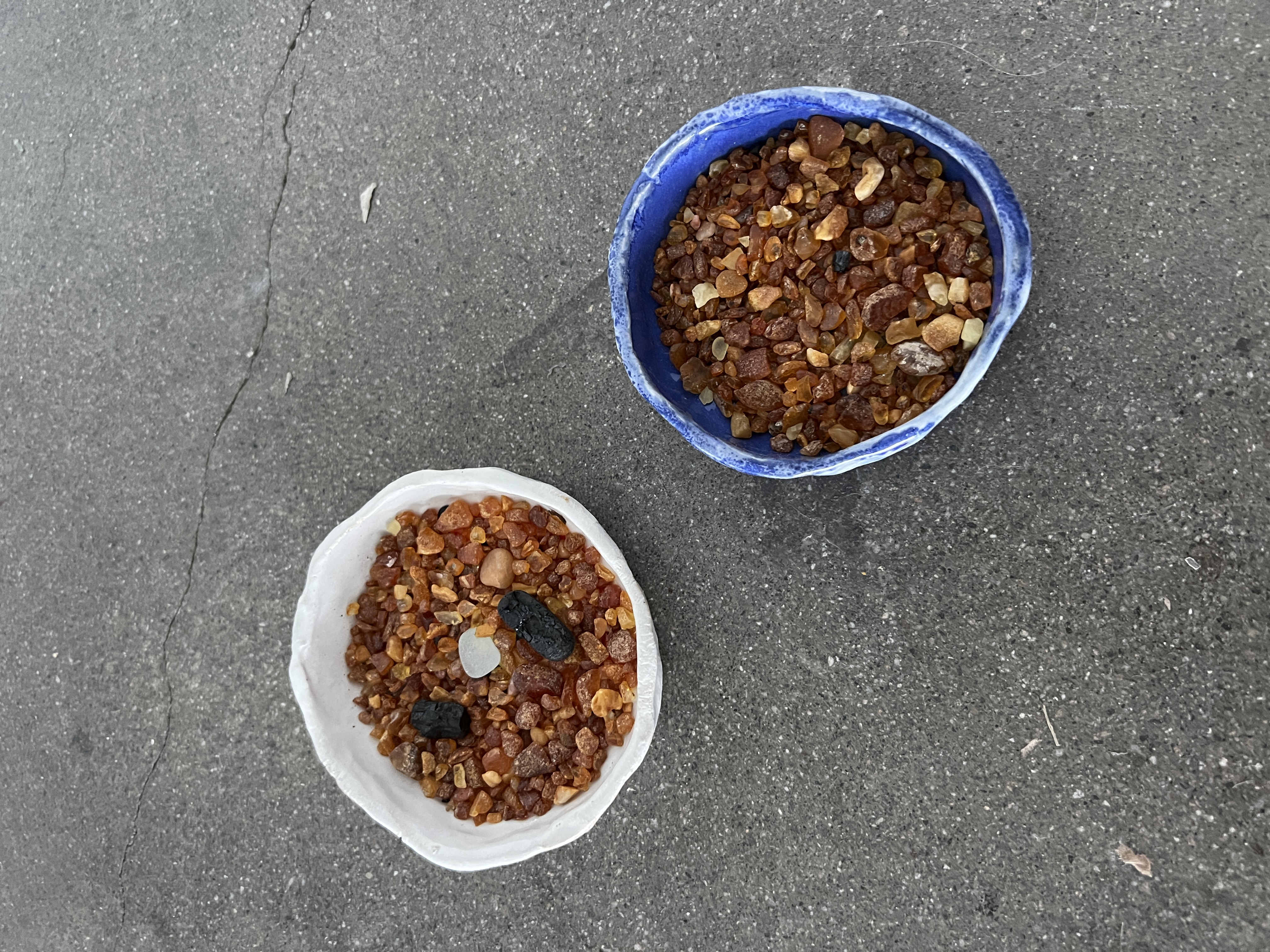 Ceramic bowls filled with Baltic amber